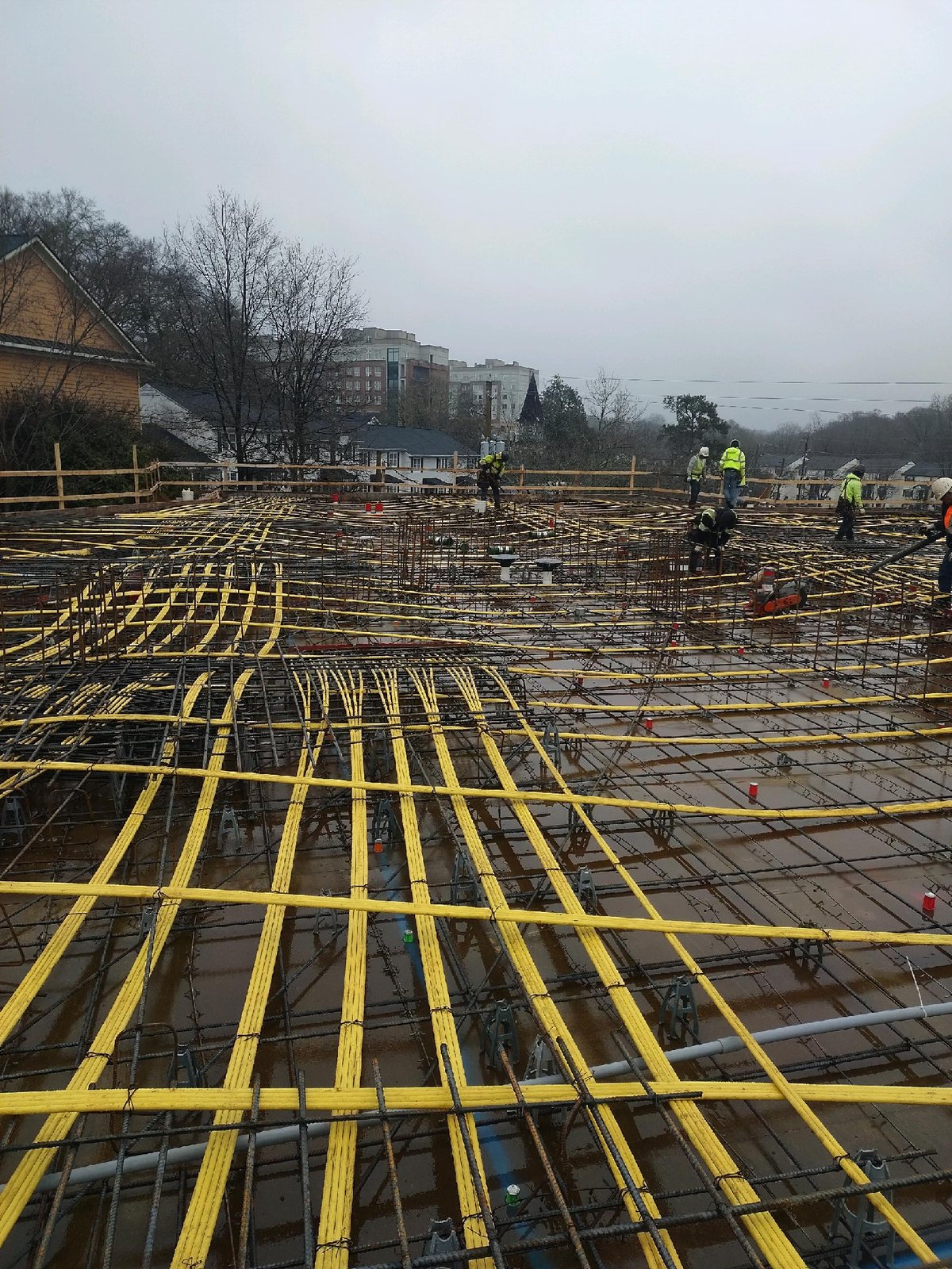 Banded post-tensioning tendons fanned across an elevated deck before the pour